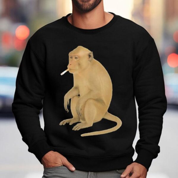 Playful primate puffing on a cigarette graphic tshirt