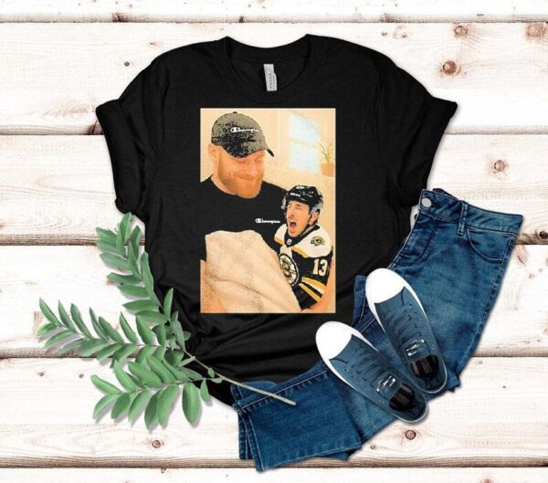 Sam Bennett Holding A Crying Brad Marchand Baby Shirt