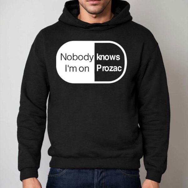 Robbie Williams Wearing Noboydy I’m On Knows Prozac Shirt