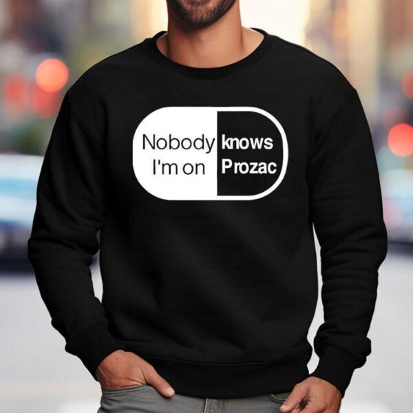 Robbie Williams Wearing Noboydy I’m On Knows Prozac Shirt