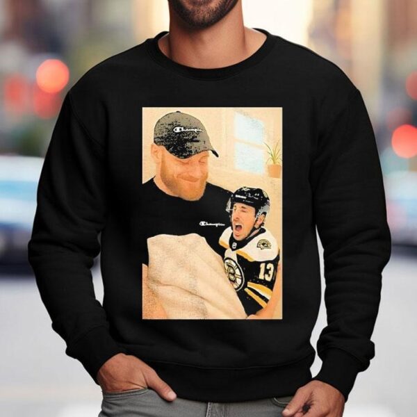 Sam Bennett Holding A Crying Brad Marchand Baby Shirt