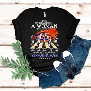 Never Underestimate A Woman Who Loves Fall And Her Denver Broncos Walking Across Signatures Tshirt