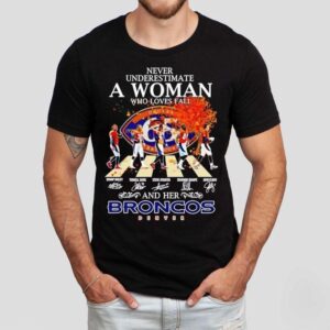 Never Underestimate A Woman Who Loves Fall And Her Denver Broncos Walking Across Signatures Tshirt