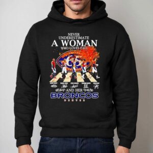 Never Underestimate A Woman Who Loves Fall And Her Denver Broncos Walking Across Signatures Hoodie